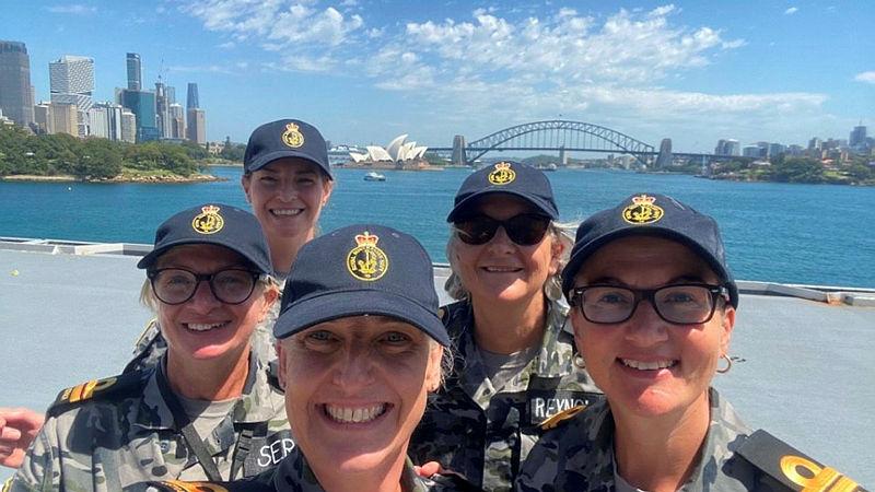 From left, Lieutenant Amanda Serra, Lieutenant Melanie Robinson, Sub-Lieutenant Meredith Leonard, Lieutenant Deb Reynolds and Lieutenant Felicity Jevardat de Fombelle on board HMAS Adelaide during a tour.