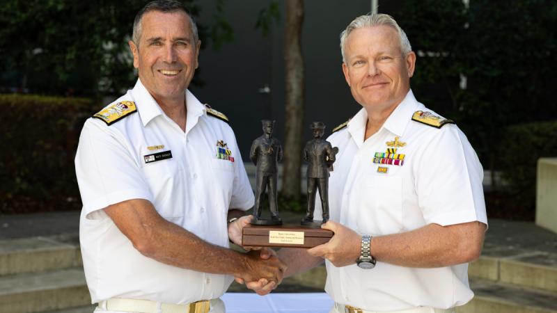 Deputy Chief of Navy, Rear Admiral Matt Buckley, receives the 'Weight' on handover from Commodore Eric Young at Russell Offices, Canberra. 