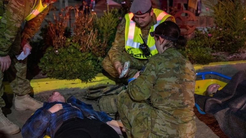 Defence and civilian agencies handle simulated mass casualties from a truck-on-train crash scenario in rural Victoria.