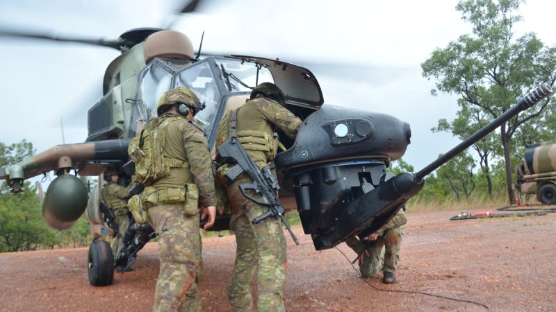 Australian Army Forward Arming and Refueling Operators, from 1st Aviation Regiment, carry out a weapon clearance drill on an ARH Tiger during Exercise Griffin Walk.