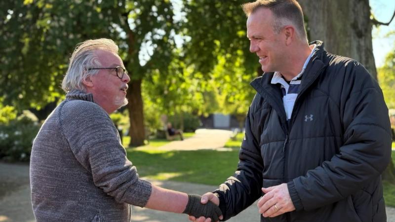 Chief of Air Force, Air Marshal Stephen Chappell, meets local man Erik Adriaensen at the graves of fallen aviators from 464 Squadron at Eindhoven, Netherlands. 