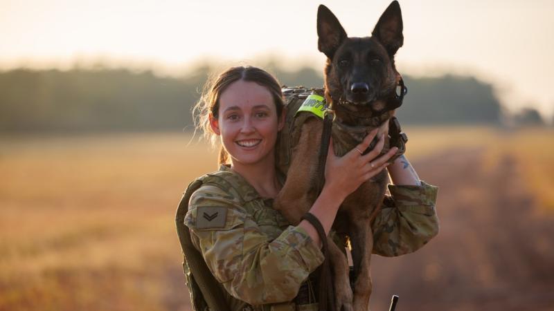 Military working dog handler Corporal Keani Charlesworth and military working dog West patrol airside at RAAF Base Darwin. 