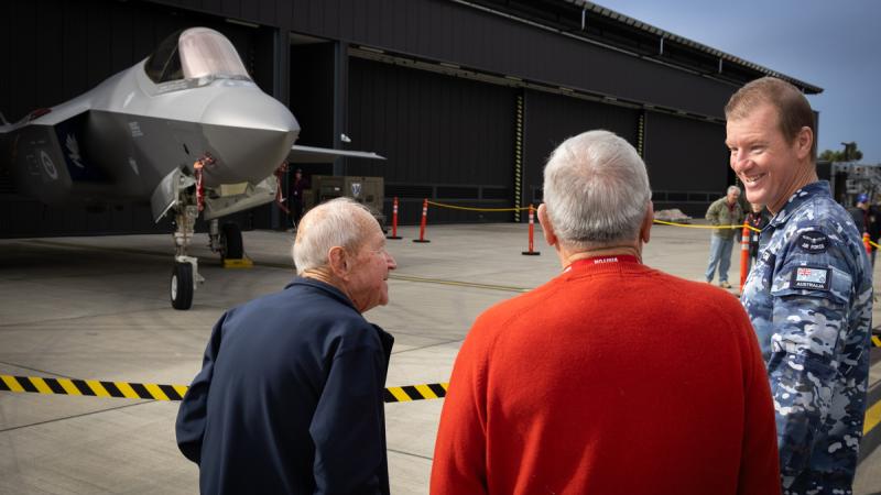 Royal Australian Air Force aircraft technician Corporal Leigh Gammie discusses the F-35A Lightning II aircraft with veterans from the Merewether Hamilton Adamstown RSL sub-Branch at 3 Squadron, RAAF Base Williamtown. 