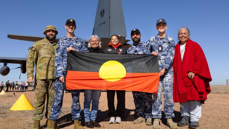 Australian Defence Force personnel meet Sydney Swans Australian Football League Women's athlete Zipporah Fish, centre, and Indigenous representatives during a community engagement event at Lake Cargelligo, NSW.