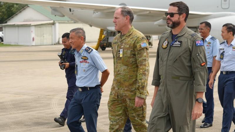 Royal Malaysian Air Force Brigadier General Tan Lai Hock, Australian Defence Adviser - Kuala Lumpur Colonel Corey Shillabeer and Officer Commanding 92 Wing Detachment Alpha, Squadron Leader Andrew Bartlett on the RMAF Butterworth flightline.
