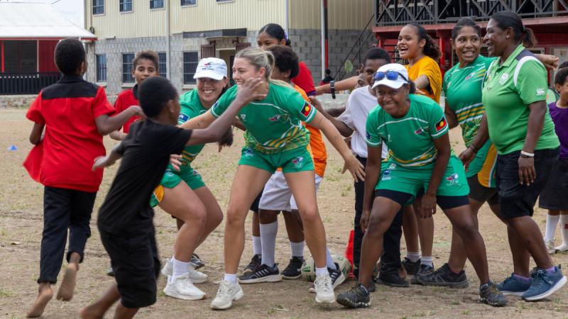 Members of the Australian Defence Force Women's Rugby League team engage with students from Waigani Christian Academy in Port Moresby, PNG. 