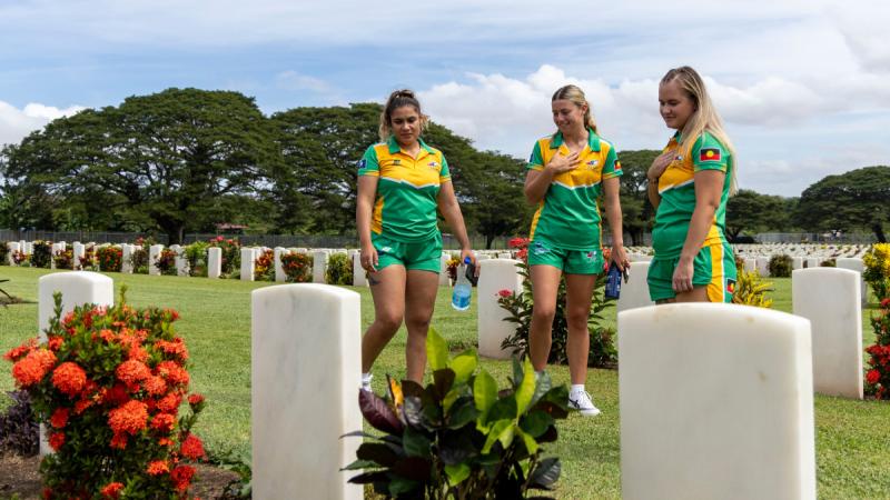Corporal Lowana McDougall, Aircraftwoman Emily Harman, and Private Hope Hutchins from the Australian Defence Force Women's Rugby League team at the Bomana War Cemetery in Port Moresby, PNG.
