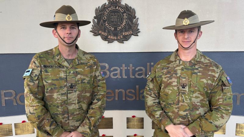 Warrant Officers Class 2 Troy Robertson, left, and Jamie Sharp, from the 9th Battalion, the Royal Queensland Regiment, responded to a high-impact vehicle incident. 