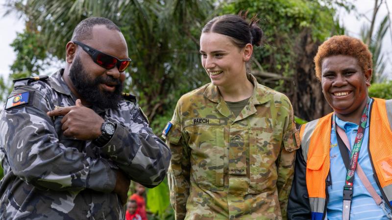 Australian Army soldier Private Erin Paech, a clerk from 6th Engineer Support Regiment, shares a moment with Papua New Guinea Defence Force officer Lieutenant Henri Beri and Connie from the East New Britain Provincial Disaster Centre during Operation Render Safe.