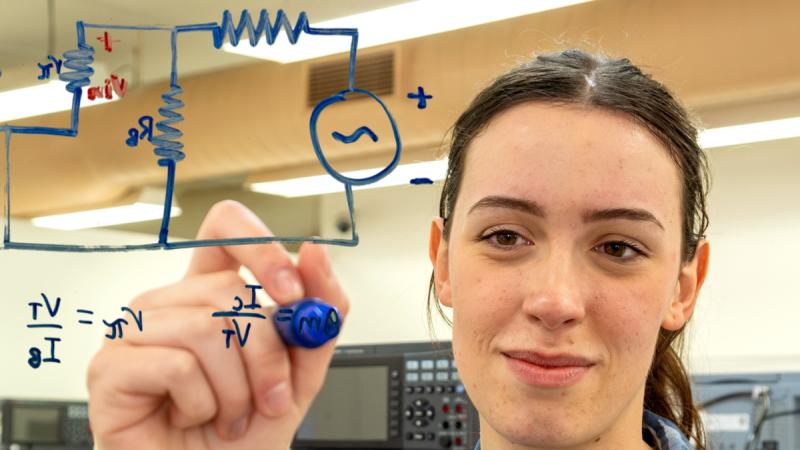 Officer Cadet Lauren Jacobs brushes up on her electrical theory at the Australian Defence Force Academy.