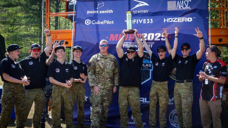 The Australian Defence Force Drone Racing Team celebrate retaining the title at the Military International Drone Racing Tournament in Lewis, New York.