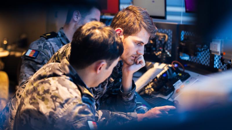 Royal Australian Navy cyber warfare specialists, shown monitoring a software disruption during Exercise Blue Spectrum, could be bolstered by the Cyber Reserve Concept.