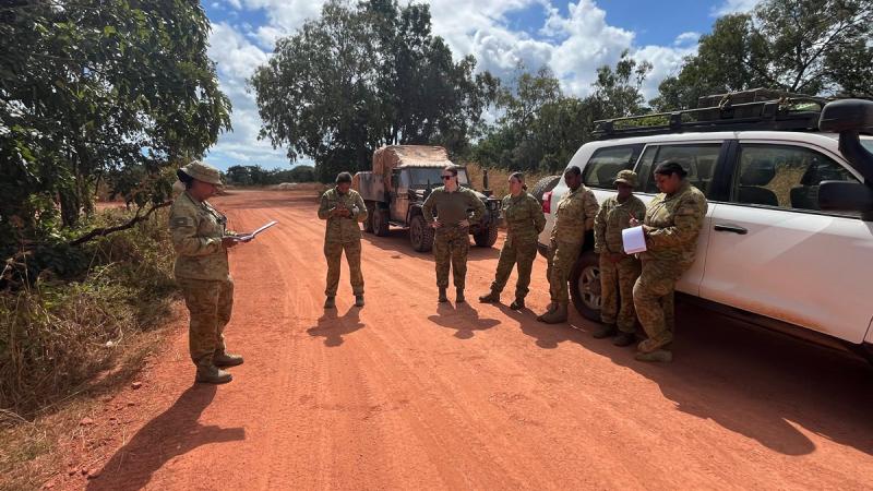 51st Battalion Far North Queensland Regiment Chief Clerk, Warrant Officer Class 2 Anne Schwartz, delivers orders to Yotam Wanch patrol members in the Cape York region.