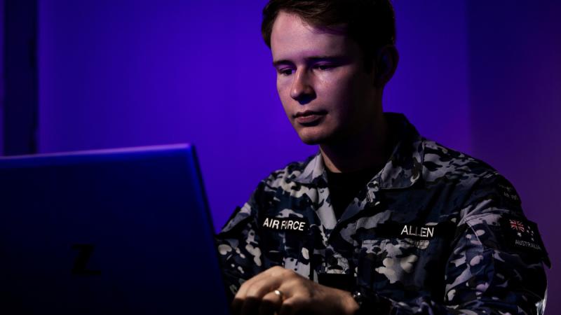 Air Force cyber warfare officer Flying Officer Samuel Allen, of 462 Squadron, Joint Capabilities Group's oldest unit, checks IT systems during Maritime Cooperative Activity last year.