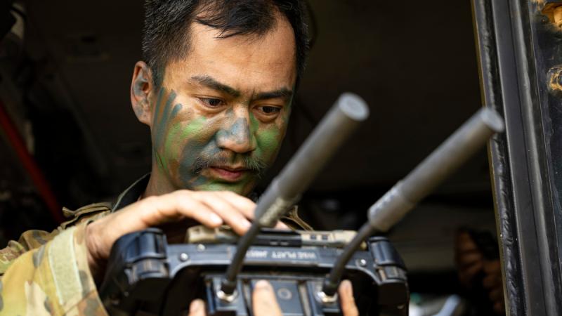 Australian Army soldier Lance Corporal Fred Jabagat, from the 1st Armoured Regiment, controls the M134D minigun remote weapon station attached to a Modular Robotic Vehicle during Exercise Talisman Sabre at Townsville Field Training Area.