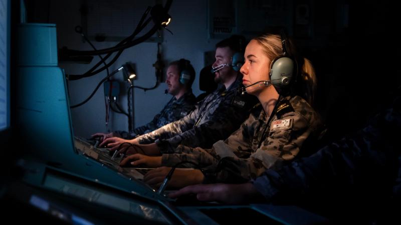 Navy combat systems operator Leading Seaman Sarah Kidd in the operations room simulator on board HMAS Stirling in Western Australia. 