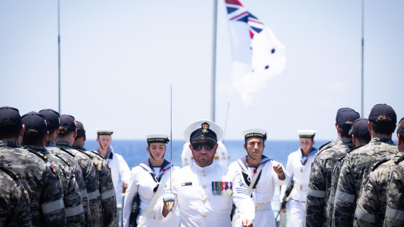 Petty Officer Christopher Jelic leads the catafalque party on board HMAS Sydney Anzac Day commemorations while on a regional presence deployment in the Indo-Pacific.