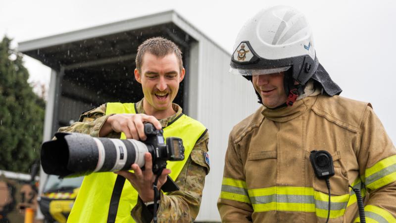 Australian Army Corporal Jack Pearce, left, shows his images Leading Aircraftman Brett Hawkless during the ADF Joint Imagery Specialist Course. 