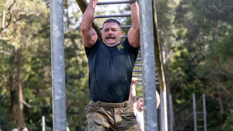 A soldiers tackling monkey bars was one of many from Land Warfare College who participated in the 2025 Canungra Combat Challenge alongside 50 civilian teams to raise money for Legacy.