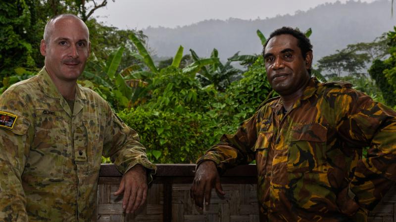 Australian Army officer Major Liam Clarke, from 3rd Combat Engineer Regiment, and Papua New Guinea Defence Force officer Captain Cyril Gerari, from Igam Barracks Engineer Battalion, on Exercise Puk Puk, in Lae, Papua New Guinea.