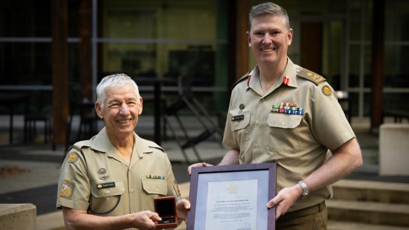 Warrant Officer Class 1 Russell Cliffe receives the Federation Star from Head of Land Capability Major General Richard Vagg at Russell Offices.