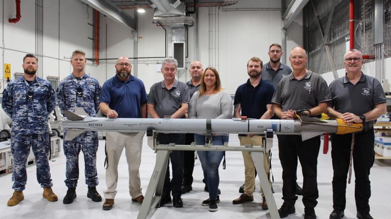 MMFA and US Government personnel celebrate completion of a milestone for training missile maintenance activity at RAAF Base Amberley.