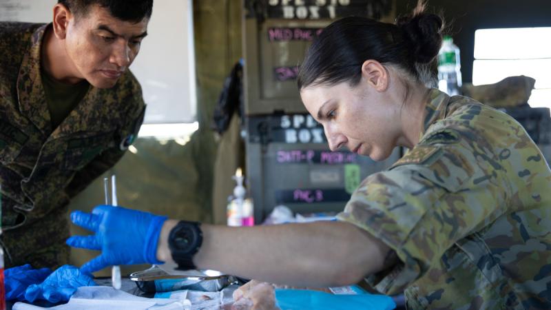 Australian Army nursing officer Lieutenant Kate Reiter demonstrates suturing during joint training with Philippine Army medics at Camp Kibaritan in Northern Mindanao.