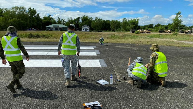 Armed Forces of the Philippines service members assess a runway during an Airfield Survey and Airfield Repair Mobile Training Team program. 