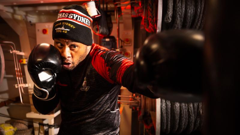 Petty Officer Philip Sameulu conducts a boxing session on HMAS Sydney during Regional Presence Deployment.