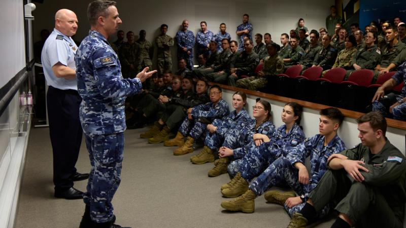 Deputy Chief of Air Force, Air Vice-Marshal Harvey Reynolds, second from left, congratulates 2 Squadron, acknowledging the 12 members of Training Flight who received a commendation for aircrew training on the E-7A Wedgetail.