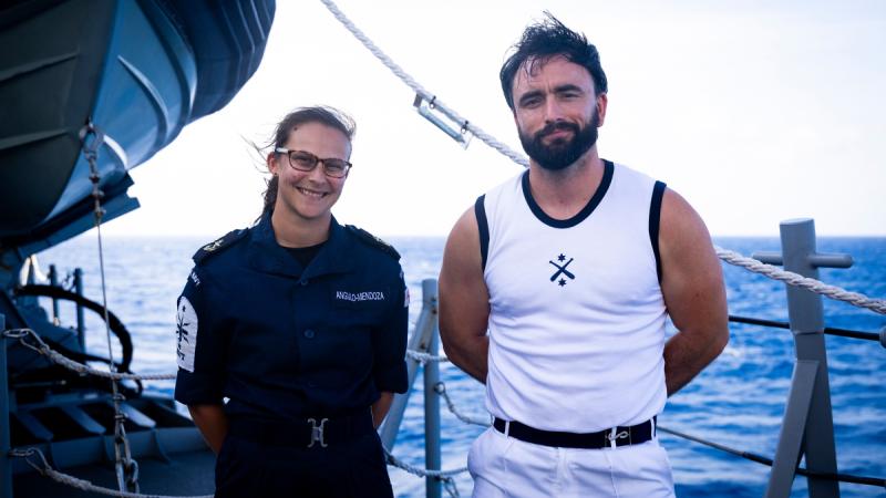 Leading Seaman Gabriella Angela-Mendoz and Leading Seaman Paul Adams, of the Royal Navy, cross-deck on to HMAS Sydney.