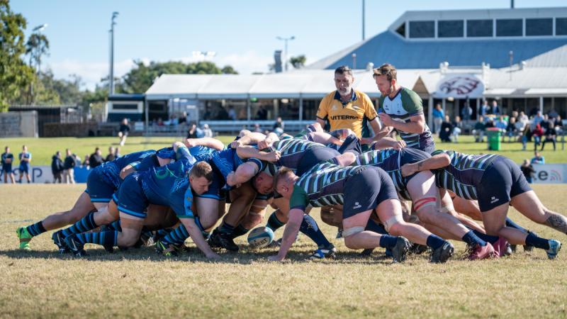 Royal Australian Corps of Signals rugby union team scrum against the Royal Corps of Signals Corps team during a 15-a-side match at the Norths Rugby Club, Brisbane.