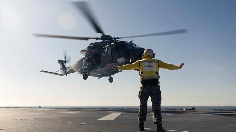 A Royal New Zealand Air Force NH90 aircraft lands on the flight deck of HMAS Canberra off the coast of Queensland. Photos: Leading Seaman Connor Morrison