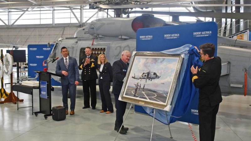 Unveiling of a commemorative artwork at Sikorsky Australia's Nowra facility mark the 50,000-flying hours and 10-years of service achieved for Australia’s MH-60R Romeo.