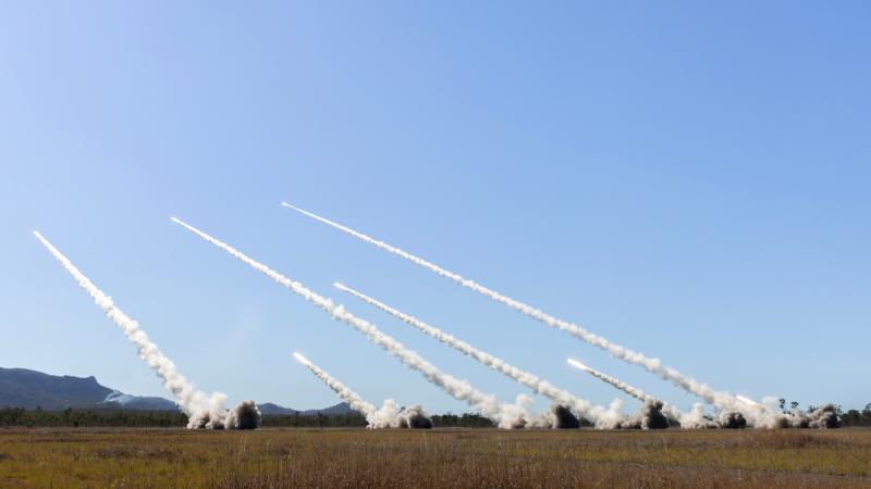 Australian Army, US Marine Corps and Singapore Armed Forces fire their respective high mobility artillery rocket systems (HIMARS) during a live-fire training activity at Shoalwater Bay training area during Exercise Talisman Sabre.