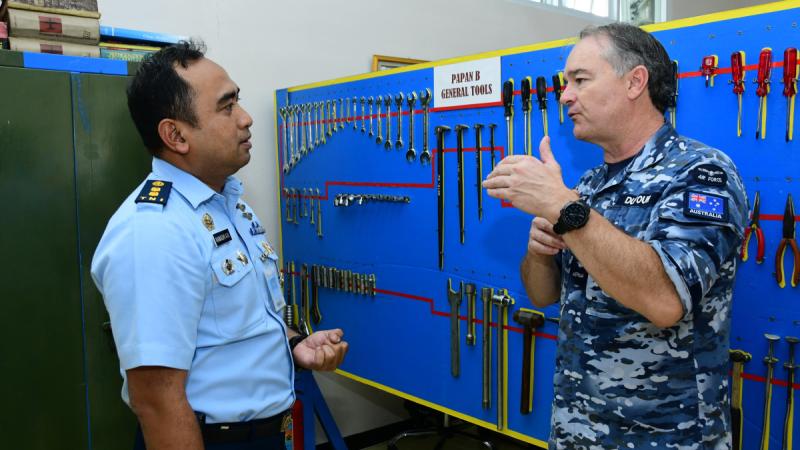 Royal Australian Air Force Warrant Officer Dimitri Dufour, right, describes the use of shadow-mount toolboards to Indonesian Air Force Letkol Tek Ramadhi Agus at Halim Air Force Base, Jakarta, Indonesia. 