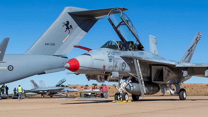 Royal Australian Air Force personnel conduct re-arming operations on an F/A-18F Super Hornet during a Forward Arming and Refuelling Point activity at RAAF Base Learmonth, Western Australia, during Exercise Talisman Sabre 2025.
