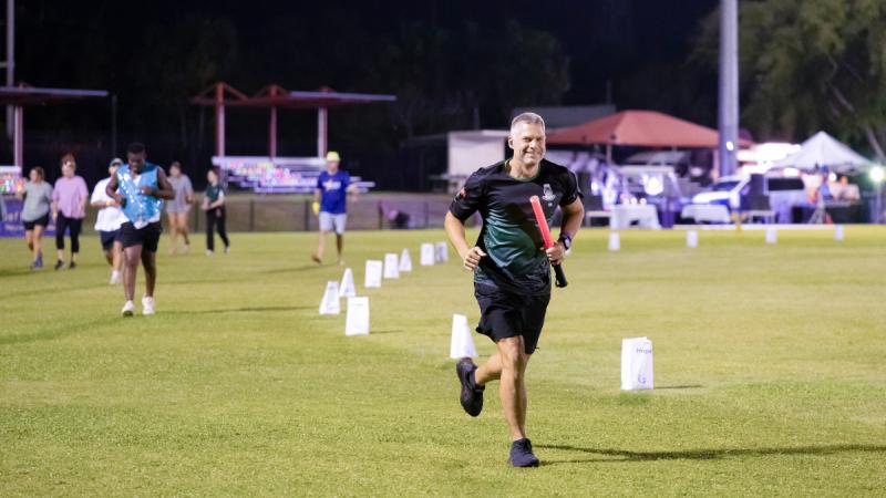 Cheerful runner taking part in the Run for Life relay race.