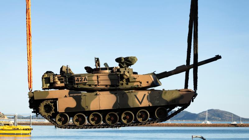 An M1A2 SEPv3 Abrams main battle tank is loaded on to a United States Naval Loading Craft Utility during Exercise Talisman Sabre at the Townsville Port.