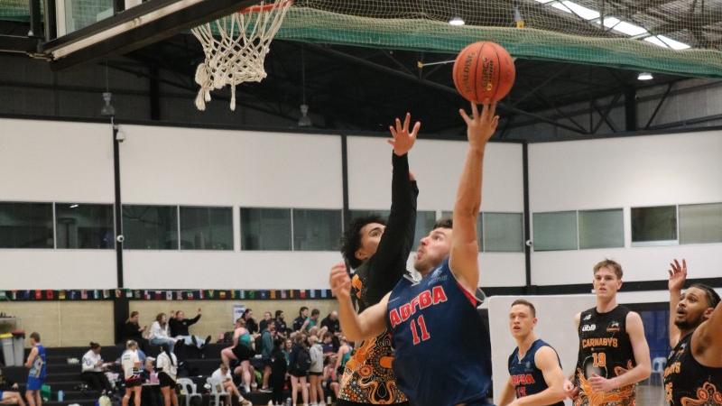 Leading Seaman James Gunson, an avionics technician in HMAS Canberra, competing in the Edith Cowan University Western Invitational basketball competition.