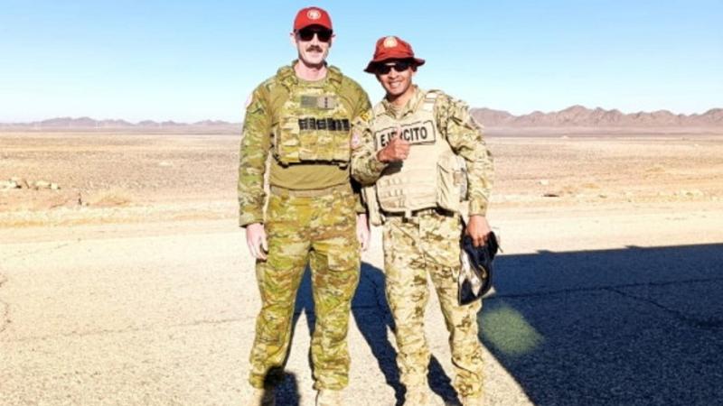 Australian Army officer Captain Michael O'Callaghan stand with a Colombian counterpart in the northern Sinai desert as part of Australia's ongoing commitment to the Multinational Force and Observers (MFO) in Egypt.