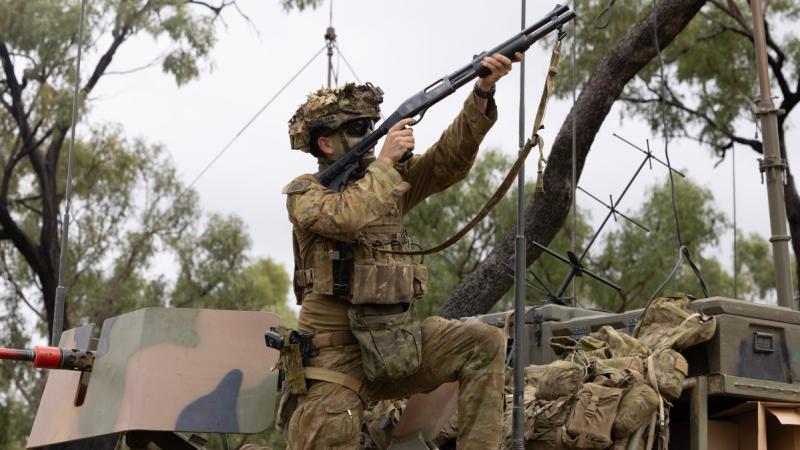 Australian Army soldier from the 3rd Battalion, Royal Australian Regiment, takes a sight picture with an anti-drone gun during Exercise Talisman Sabre 2025 at Townsville Field Training Area, Qld.