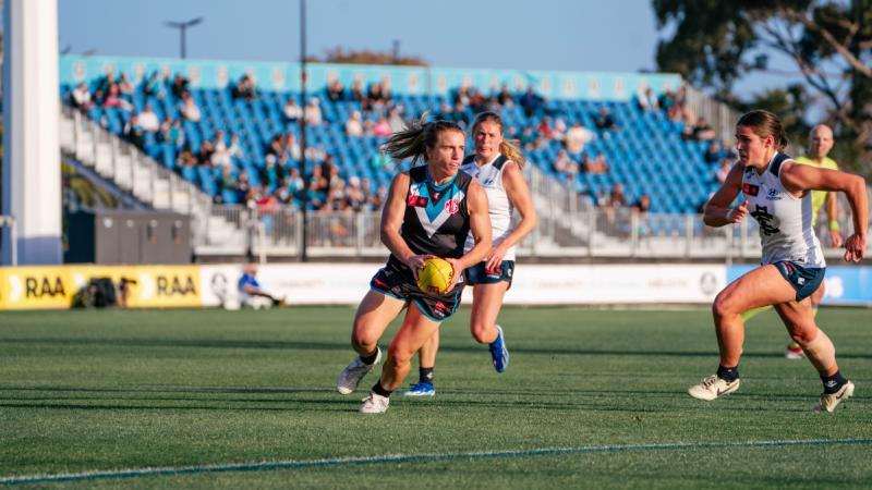 Flight Sergeant Maria Moloney plays for Port Adelaide in the AFLW. 