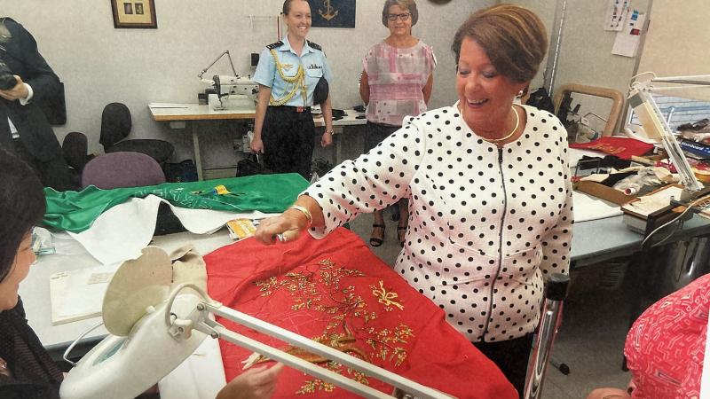 Lady Lynne Cosgrove examines regalia at Spear of Fame in 2017 during an official visit with her husband, then Governor-General Sir Peter Cosgrove.
