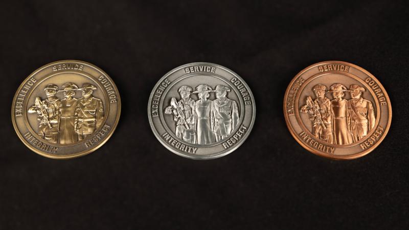 Army Service Medallions for, left to right, 20 years, 10 years, four years.