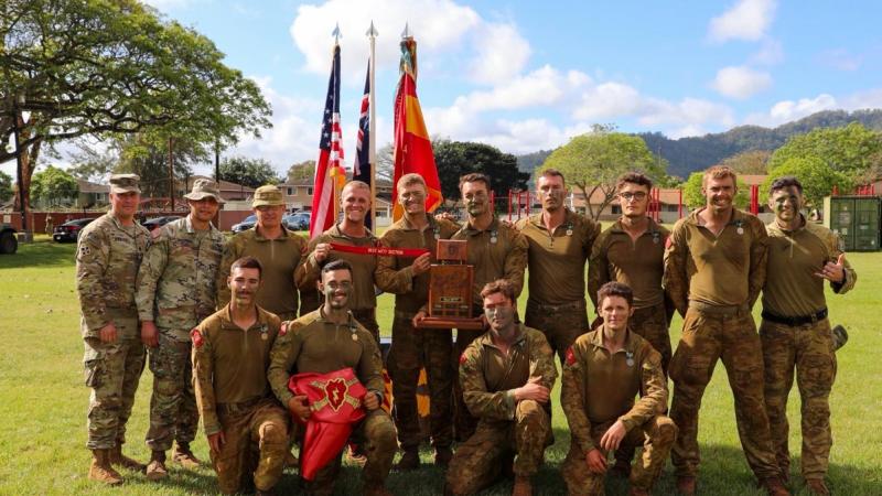 Australian Army gunners from the 1st Regiment, Royal Australian Artillery, with the winners trophy on completion of Best by Test in Hawaii.
