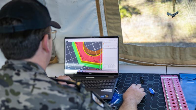 Navy marine technician Able Seaman Lachlan Hannan conducts work in the Deployable Additive Manufacturing and Repair unit near Gladstone during Exercise Talisman Sabre 25. 