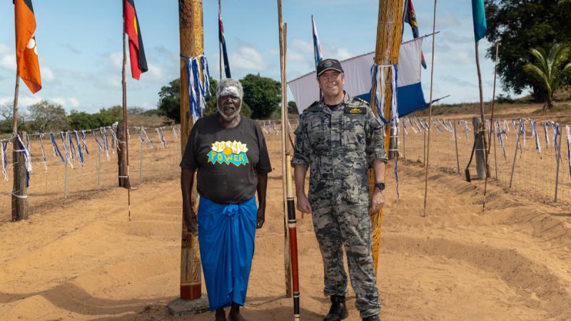 Rear Admiral Buckley and Dr Marawili stand side by side in the middle of the Sea Rights Yingapuyŋapu sculpture. 