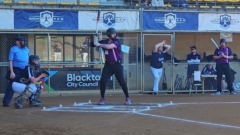 Royal Australian Navy sailor Chief Petty Officer Daniel Conway-Jones bats against a Victorian team at the Softball Australia Over-35 National Championships.