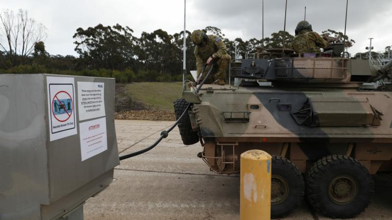 An armoured vehicle fills up at a renewable diesel pump.